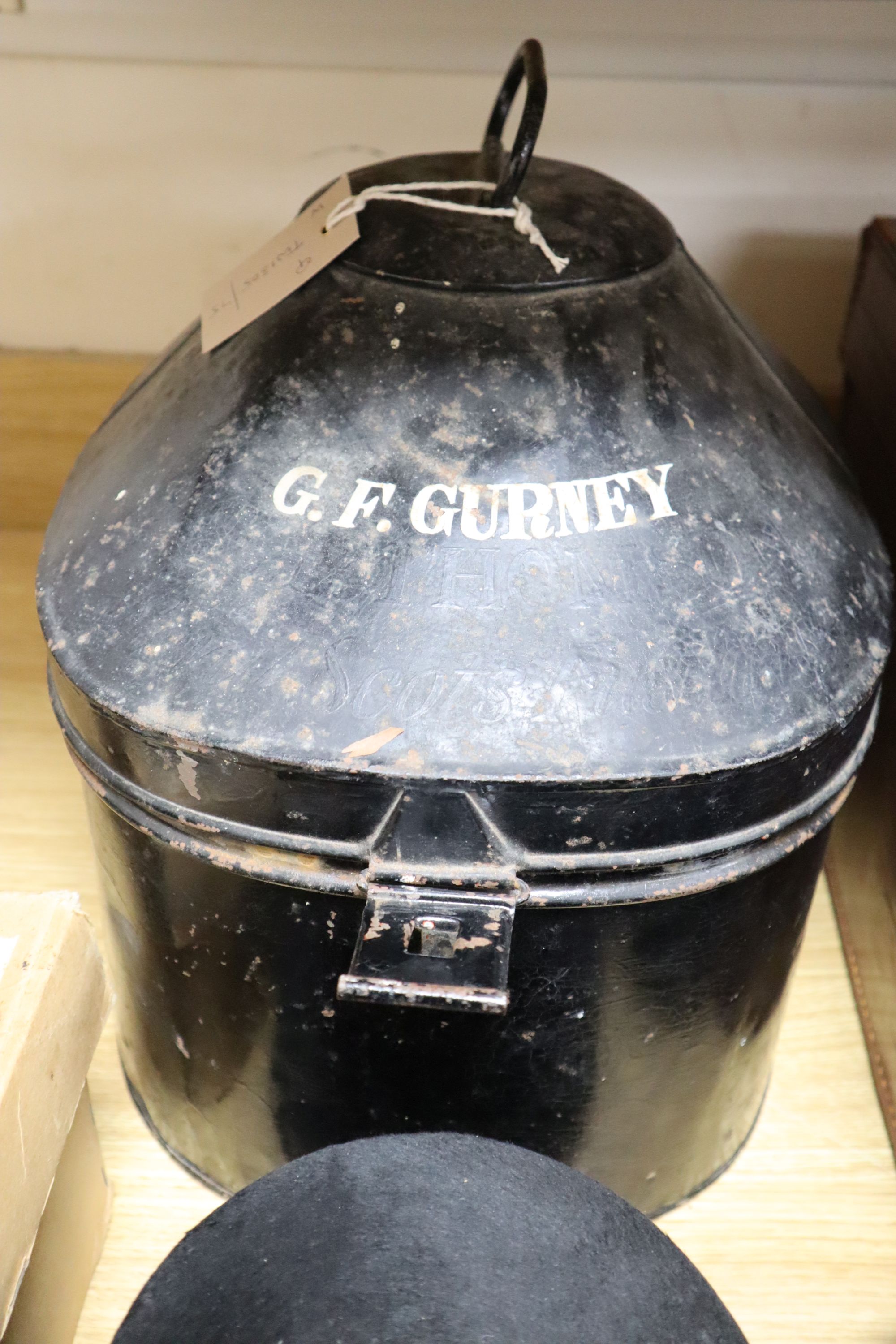 A solar pith helmet in japanned metal case, a military cap, a leather dressing case and seven other gentlemens hats, 9